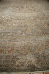 Sparta carpet's distressed pile texture, showing faded floral blossoms and visible knot heads.