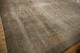 Distressed vintage Sparta carpet, showing faded floral blossom motifs and mostly even wear.