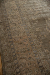 Textured pile of the Distressed Sparta carpet, with faded dusty sage florals and visible knot heads.
