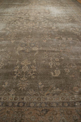 Textured distressed dusty sage floral vinery pattern on a vintage Sparta rug.