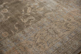 Textural distressed pile of vintage Sparta carpet, showing faded floral motifs.