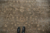Distressed vintage Sparta carpet revealing olive green floral motifs and mostly even wear.