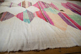 Hand woven ivory texture with abstract pink, emerald green, aubergine striations.