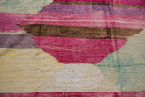Textured hand woven details showing abstract pink, aubergine, brown, and ivory striations.