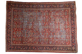 Vintage Mahal carpet, brick red field, allover floral vinery pattern, navy blue borders.