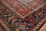 Vintage Persian Mahal carpet corner, brick red floral vinery field and navy blue border.