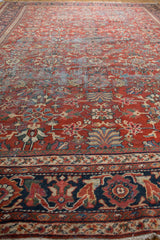 Vintage Mahal rug border detail, with brick red field, navy blue, beige floral patterns.