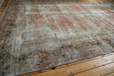 Artfully distressed Mahal rug texture, highlighting time-softened blush, seafoam, and charcoal tones.