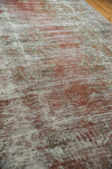 Distressed Mahal carpet showing exposed foundation, with faded terra cotta and ivory.