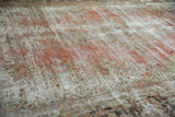 Distressed Mahal rug pile texture, revealing white foundation and faded blush with seafoam green.