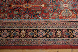 Mahal carpet border detail featuring navy, blush, sky blue patterns and red selvage.