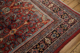 Hand-knotted Vintage Mahal carpet corner, intricate navy, red, sky blue border, dense floral field.