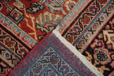 Hand-knotted Persian Mahal carpet corner with red selvage and intricate floral pile.