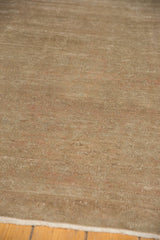 Textured pile of a distressed Sivas carpet with subtle abrashes and earthen tones.