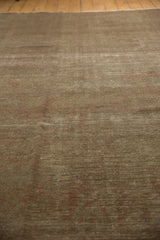 Tone-on-tone texture of vintage distressed Sivas carpet with muted earthen shades.