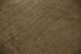 Distressed Sivas carpet showing subtle design, earthen tones, and wear to foundation.