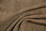 Textural detail of the distressed Sivas carpet showing earthen abrashes and visible foundation.