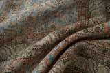 Textured vintage Tabriz rug featuring intricate Herati design, pale sky blue, terracotta blush, ivory hues.