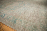 Vintage Distressed Oushak rug corner with a sea foam green palmette and vine border.