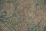 Distressed Oushak rug pattern with ocean green and pale coffee brown floral vinery.