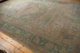Vintage distressed Oushak rug: faded sea foam green palmette border and floral field.