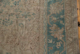 Distressed vintage Oushak pile with even wear, faint foundation. Ocean green main border, muted floral field.