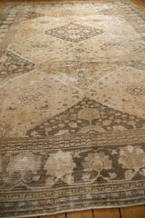 Vintage distressed Khorassan carpet's palmette border and multi-diamond pattern with mostly even wear.