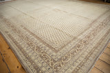Distressed Sivas carpet corner: ivory, dark beige Serbend vine border, boteh patterns.