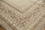Vintage distressed Sivas rug corner with ivory Serbend vine and boteh borders.