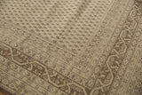 Ivory and dark beige Sivas rug detail: boteh field and Serbend vine borders with even wear.