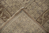 Distressed Sivas carpet corner, showing pile wear, intact selvage, and woven foundation.