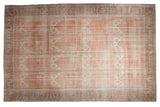 Vintage Distressed Oushak rug, dusty blush paneled field, ivory motifs, oxidized silver palmette border. 11x17.