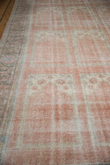Distressed vintage Turkish Oushak carpet showing faded blush and ivory paneled motifs.