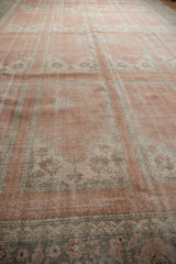 Vintage Distressed Oushak carpet, blush and beige paneled motifs, visible texture and wear.