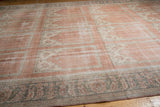 Distressed blush field meets time-softened silver palmette border with intact selvage.