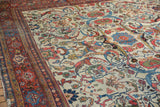 Vintage Mahal rug: ivory field with oversized vinery, palmettes, and lotus flowers.