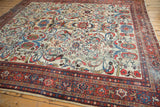 Vintage Persian Mahal rug corner: ivory field, oversized vinery, lotus, red Samovar border.