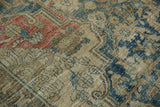 Distressed vintage Heriz carpet texture with faded red, blue, and beige Rococo floral designs.