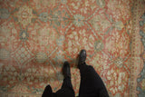 Textural wear of a distressed vintage Mahal carpet, displaying softened floral vinery.