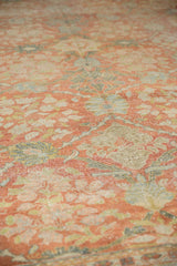 Textured distressed Mahal carpet pile, with faded terra cotta and green floral motifs.