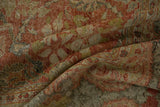 Distressed vintage Mahal carpet detail showing terracotta, green motifs and worn pile to foundation.