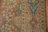 Low distressed pile of vintage Mahal carpet, terra cotta and dusty lime green floral vinery.