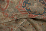 Distressed Oushak rug pile with soft blush, teal, and beige tones.