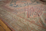 Vintage Distressed Oushak rug's muted blush and beige border with dusty teal motifs.