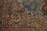 Vintage Malayer carpet detail, denim blue scalloped spandrel and beige millefleur field.