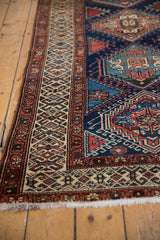Vintage Northwest Persian runner: geometric ivory, red border; navy field; short fringe.