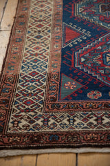 Northwest Persian runner's hook-and-latch border and navy field with triangular guls.