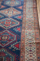 Vintage Northwest Persian runner's intricate side border with geometric patterns, terra cotta, ivory, navy.