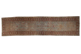 Vintage distressed hand knotted Heriz runner, abrashed blue-green field, reddish Herati pattern.