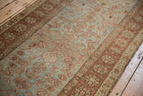 Worn pile on distressed Persian Heriz runner with Herati motif and floral border.